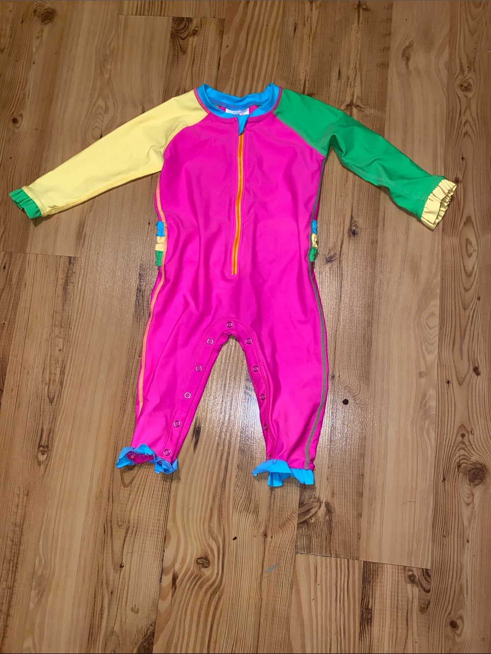 Ruffle Butts Pink One-Piece Swim Sunsuit with Yellow and Green Sleeves